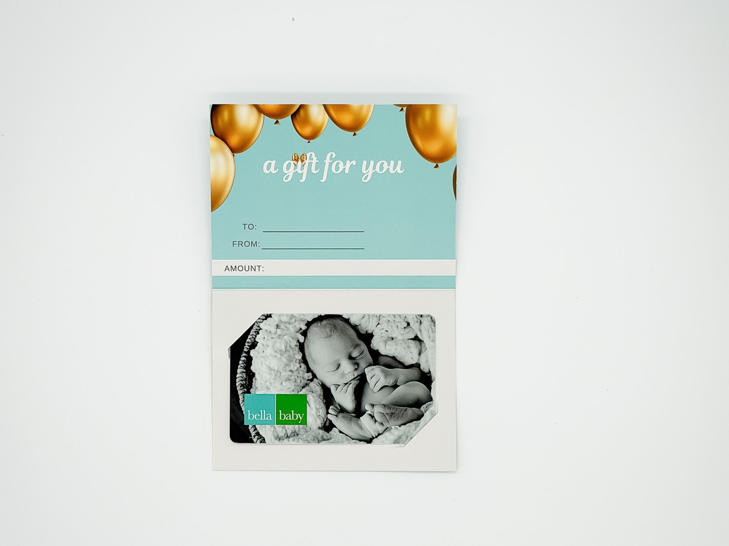 Inside of a Bella Baby gift card holder showing the gift card and 