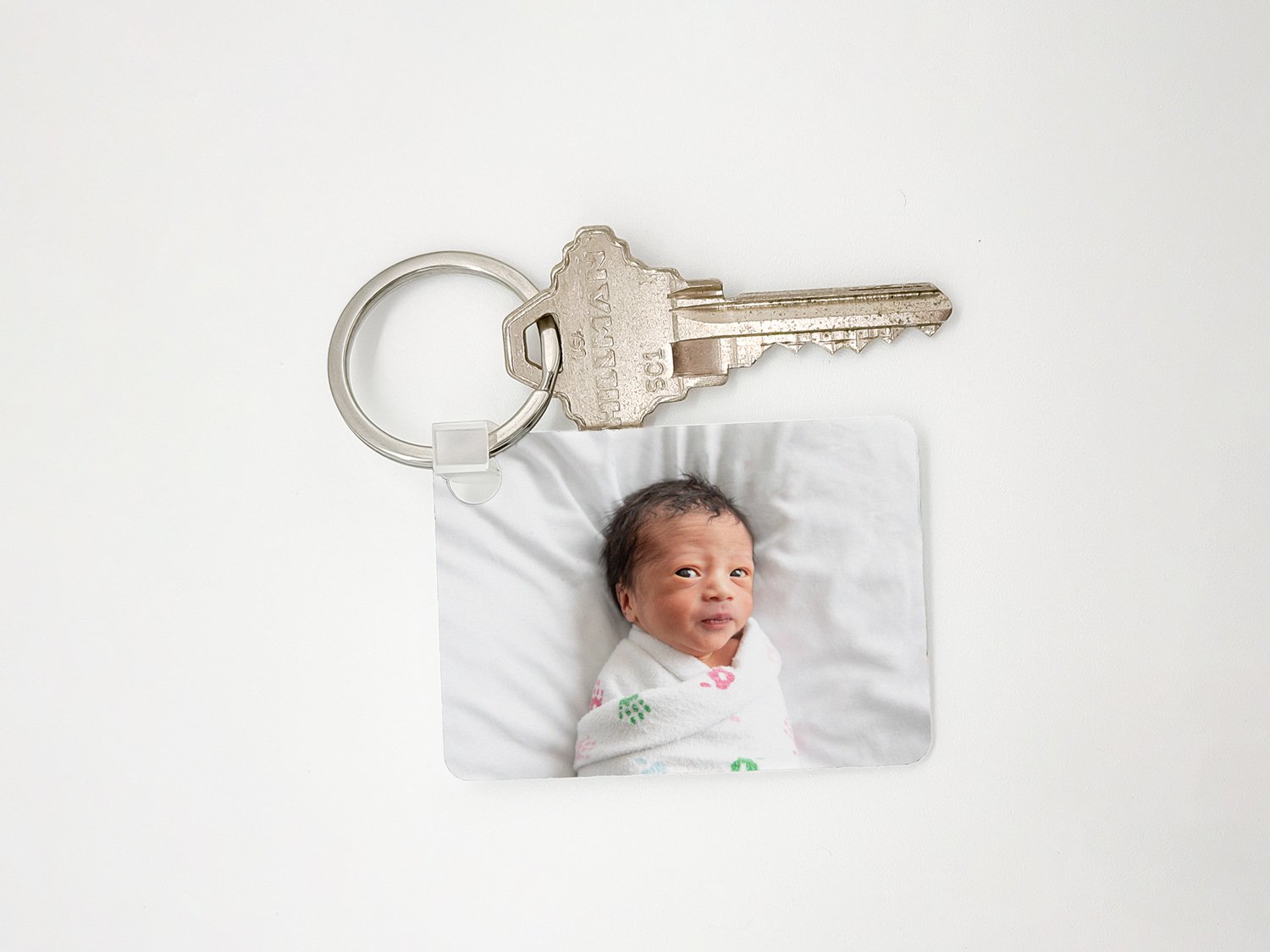 Photo keychain featuring a newborn baby