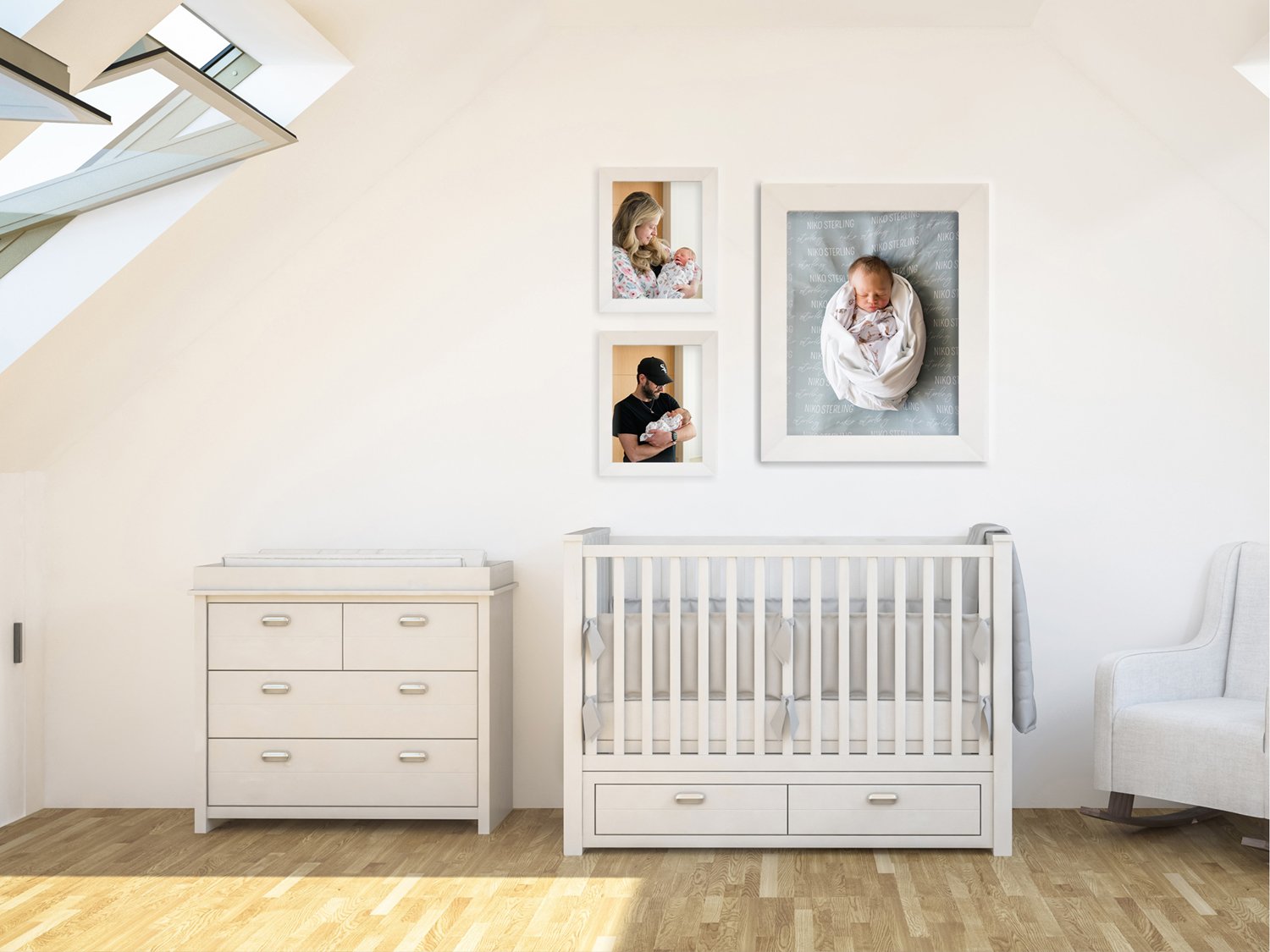 Example of a nursery with three framed prints in different sizes above a crib