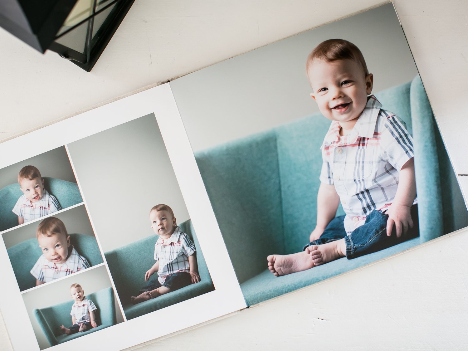 Open photo album showing photos of a smiling little boy