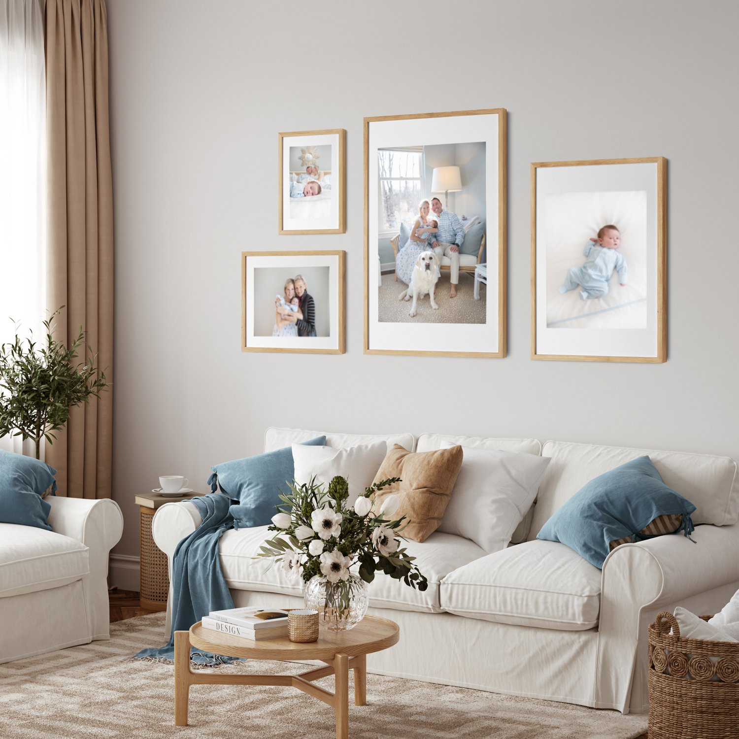 Four framed family photos in varying sizes arranged on a living room wall to create a gallery display.