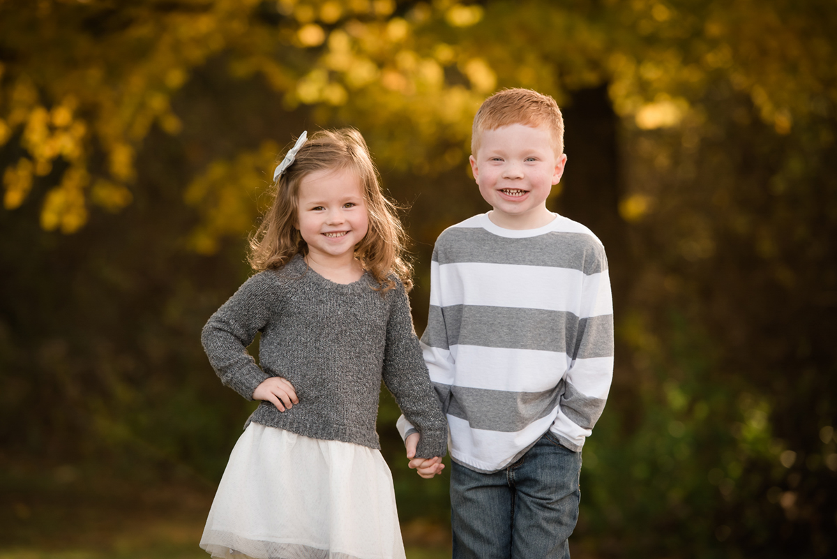 Example of siblings dressed in comfortable, non-restrictive clothing for a relaxed photo session.