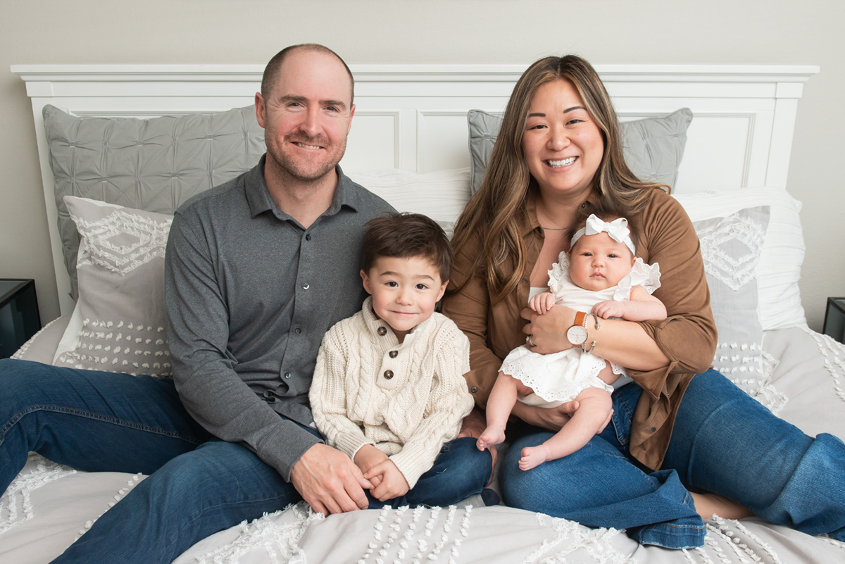 Family of four dressed in coordinated neutral tones for a timeless, cohesive look.