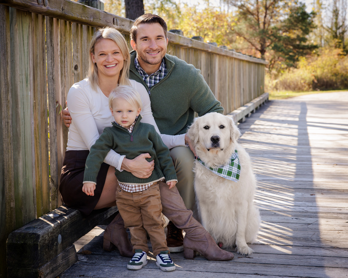Example of a family styled with plaid shirts and solid sweaters for versatile layering.
