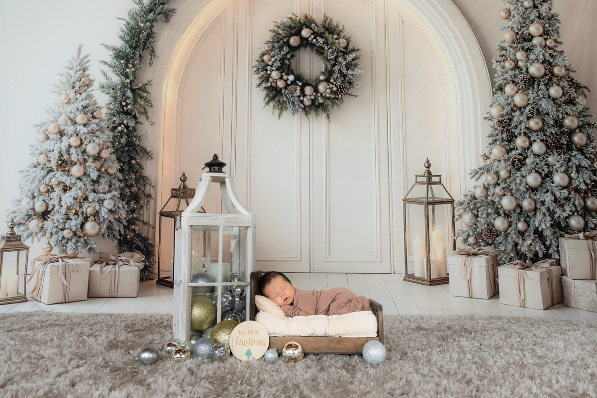 Newborn baby sleeping during a Christmas themed photoshoot